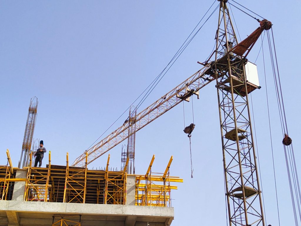 a person standing on a crane